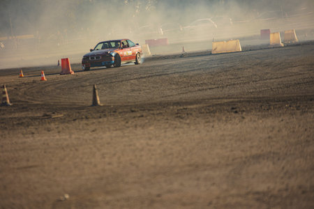 Villamarzana, 10 September 2023: Intense car race capturing the thrill of drifting on a challenging...