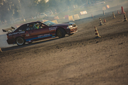 Villamarzana, 10 September 2023: Intense car race capturing the thrill of drifting on a challenging...