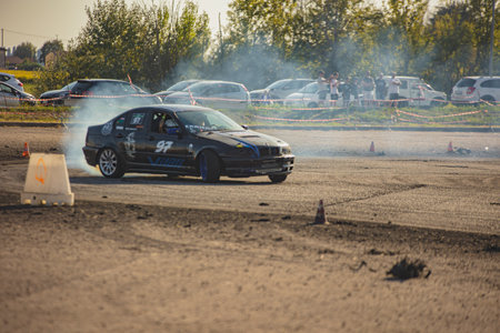 Villamarzana, 10 September 2023: Intense car race capturing the thrill of drifting on a challenging circuit.のeditorial素材