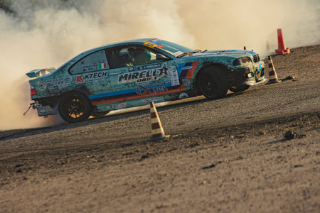 Villamarzana, 10 September 2023: Intense car race capturing the thrill of drifting on a challenging...