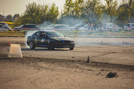 Villamarzana, 10 September 2023: Intense car race capturing the thrill of drifting on a challenging circuit.のeditorial素材