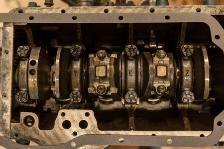 Close-up detailing the intricate process of restoring a vintage engine to its former glory.の写真素材