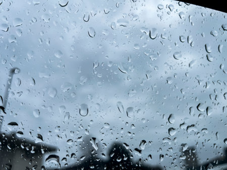 Close-up texture of raindrops on a window.の写真素材