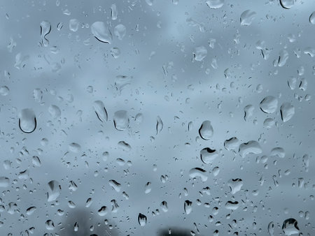 Close-up texture of raindrops on a window.の写真素材