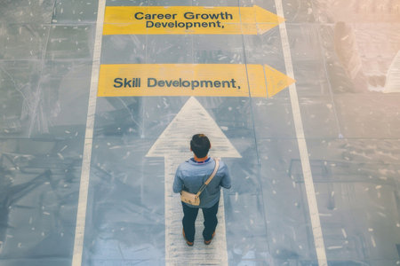 Worker at painted crossroads in office, signs: Career Growth, Skill Development, symbolizing career decisions.の素材