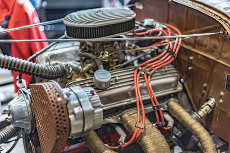 Pristine vintage American car engine exposed, showcasing classic engineering and automotive history.
