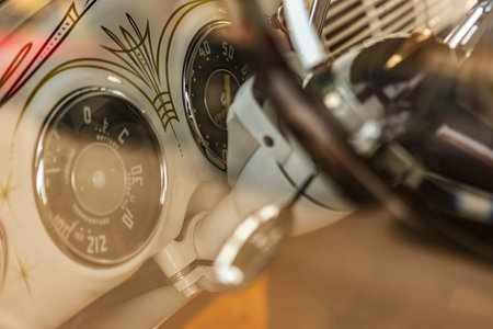 Close-up view of a vintage American car's interior, highlighting unique details and craftsmanship.