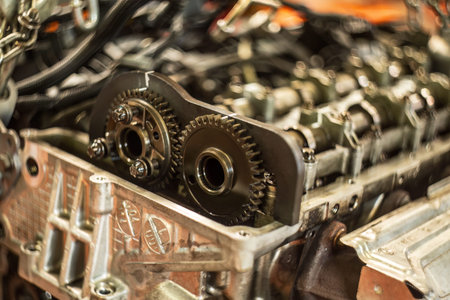 Detailed view of a car engine's timing chain with maintenance and replacement symbol.