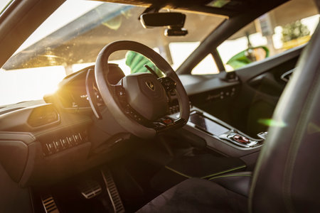 Adria, Italy 30 July 2024: Interior dashboard view of a Lamborghini with a focus on the steering wheel and controlsのeditorial素材