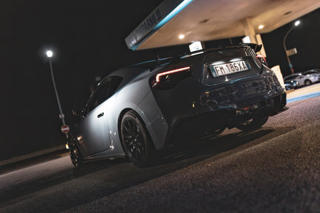 Adria, Italy 30 July 2024: Subaru BRZ with sleek design and aftermarket modifications parked at a gas station during the nightのeditorial素材