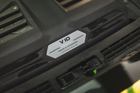 Adria, Italy 30 July 2024: Close-up of the V10 engine badge on a Lamborghini, symbolizing its impressive performance capabilities.のeditorial素材