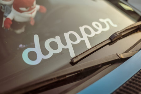 Adria, Italy 30 July 2024: Close-up of a windshield with a Dapper sticker and plush toys inside.のeditorial素材