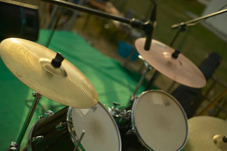 Golden cymbal and microphones ready for recording a drum solo during a music festival