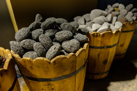 Volcanic rock and pumice stones for sale in wooden buckets at a shop in port ghalib, egypt