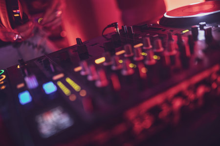 Rome, Italy 4 May 2025: close-up of a dj controller board with colorful lights, creating an exciting nightlife atmosphereの写真素材