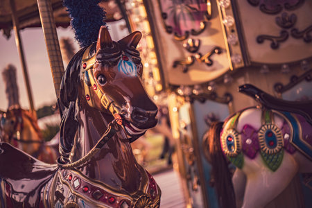 brown carousel horse turning in an amusement park in chioggia and sottomarina, italy