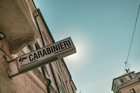 Rovigo, italy 21 june 2025, sunlight highlights carabinieri sign on a building in rovigo, italy, representing italian law enforcementの写真素材