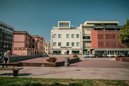 Rovigo, Italy 21 June 2025, architectural landscape showing the blend of modern and traditional buildings in Rovigo, Italy, on a sunny dayの写真素材