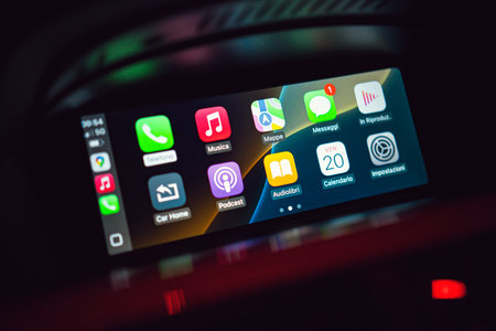 Chioggia, Italy 21 June 2025, close up of a car infotainment system showing smartphone apps, emphasized modern vehicle technology and connectivityの写真素材