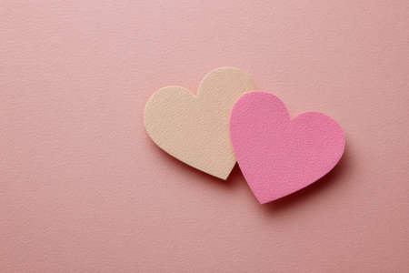 Overlapping paper hearts creating a romantic ambiance, perfect for celebrating love on valentine's day and expressing deep affectionの素材