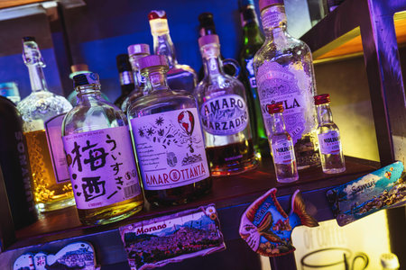 Rovigo, Italy 18 December 2025: assorted international alcoholic spirits and liqueurs displayed on a...