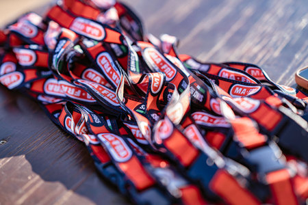 Imola, italy 01 january 2026: ma-fra branded lanyards, a pile of promotional merchandise for a...