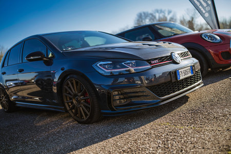 Imola, italy 01 january 2026: custom volkswagen golf gti with aftermarket body kit and alloy wheels...