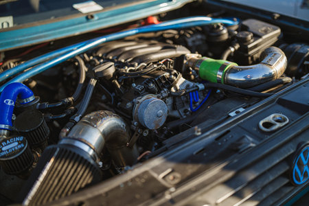 Imola, italy 01 january 2026: car engine featuring a cold air intake, strut bar, and custom...