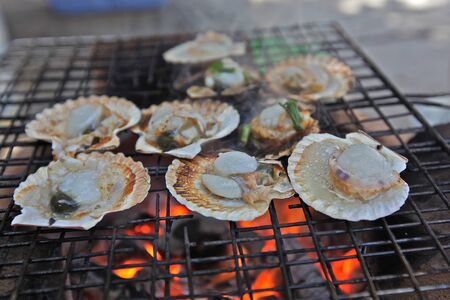 scallops cooked on the fireの写真素材