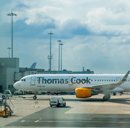 MANCHESTER, UK - 9TH APRIL 2019: A Thomas Cook aircraft sits waiting for passengers at Manchester Airportのeditorial素材