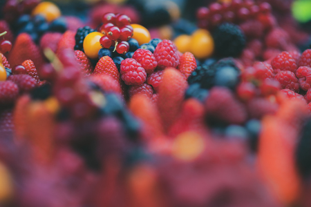 Close up of a selection of bright fresh fruit berries - Includes Strawberry, Blueberry, Raspberry, Blackberry, Redの写真素材