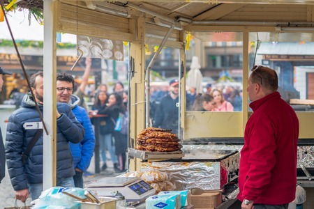 PRAGUE, CZECHIA - 10TH APRIL 2019: Tourists and locals gather around the Prague Old Square to visit the stalls from the Easter Market - A famous Czech traditionのeditorial素材
