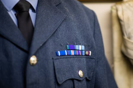 DONCASTER, UK - 28TH JULY 2019: A RAF uniform from World War 2 on display at Doncaster Aviation Museum with ribbons and medalsのeditorial素材