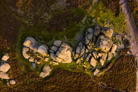 Beautiful sunset over the Wheel Stones found near Derwent Edge in the Peak District National Park,...