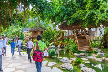 Tam Coc, Vietnam - 19th October 2019: Crowds of tourists visit the famous Mua Caves and beautiful scenic landscape around the bottom of the mountain.のeditorial素材