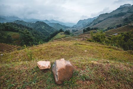 Beautiful shot of Sapa and the surrounding mountains in North Vietnam during a overcast day in Autumn 2019の写真素材