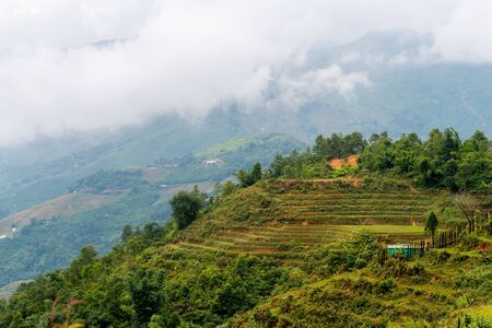 Beautiful shot of Sapa and the surrounding mountains in North Vietnam during a overcast day in Autumn 2019の写真素材