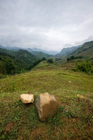 Beautiful shot of Sapa and the surrounding mountains in North Vietnam during a overcast day in Autumn 2019の写真素材