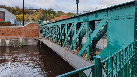 Aftermath of the River Don flooding in Sheffield, November 2019. Bridges clogged up with sticks and debris show the height of the water level during the floodの写真素材