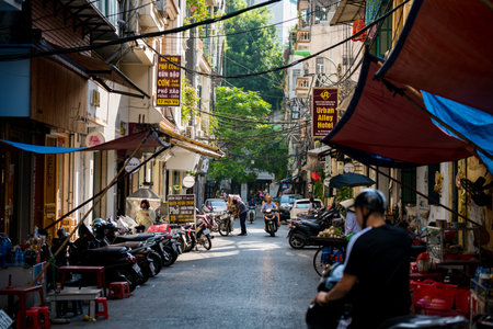 Hanoi, Vietnam - 18th October 2019: One of the many narrow busy backstreets found in the Capital city, full of traffic and pedestriansのeditorial素材