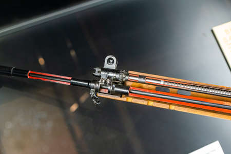 Close up of 7.62mm rifle. Black coloured, broken apart with the parts exposedの写真素材