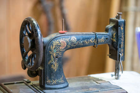 Aldershot, UK - 5/9/2020: Vintage old Singer Sewing machine on display in an exhibit in an army museum in the uKのeditorial素材
