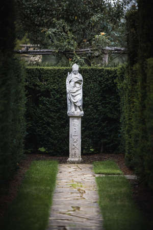 Beautiful stonework statue of a priest in the castle of Hever Castle in Kent, UKの写真素材