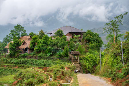 Small rural house on the side of rice paddies along Sapa dirt road in Northern Vietnam. October 2019の写真素材