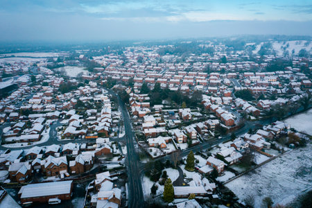 Snowfall and whiter fog over small English rural village in countryside, Cheshire UK. Christmas 2020. Early morningの写真素材