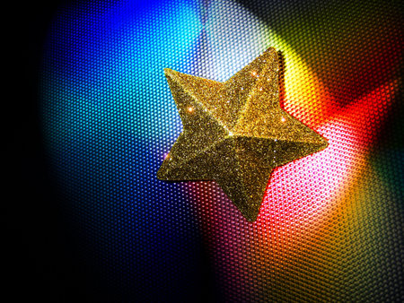 Yellow Star on colored steel backgroundの写真素材