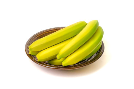 Bananas on the dish with white background.の写真素材