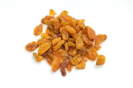 The dried raisins on a white background.の写真素材