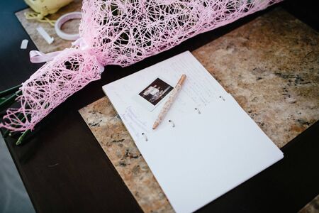 Album for wishes at the wedding is on the table on the photoの写真素材