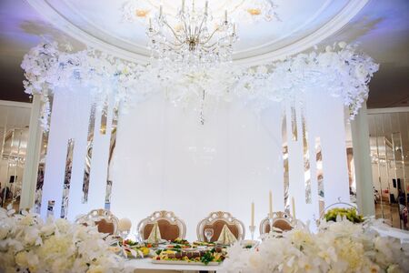 Festive and solemn decoration of the banquet room on the wedding dayの写真素材